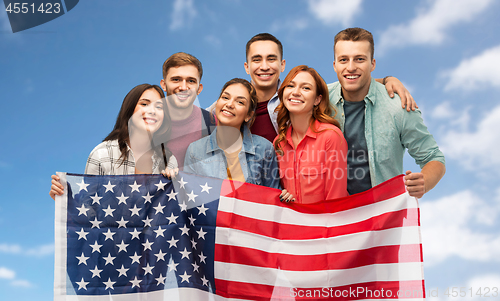 Image of group of smiling friends with american flag