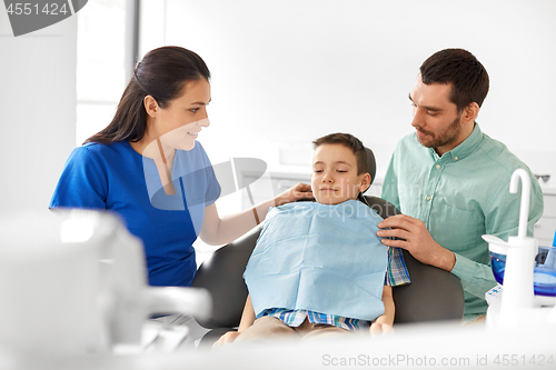 Image of female dentist with kid patient at dental clinic