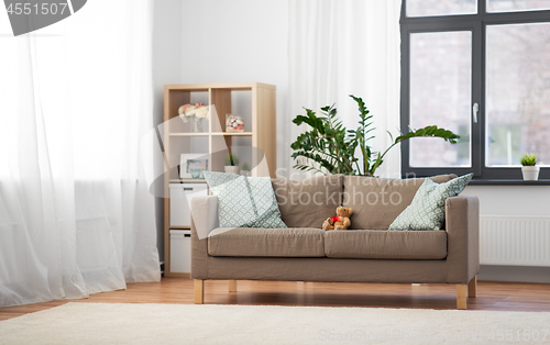 Image of sofa with cushions at cozy home living room