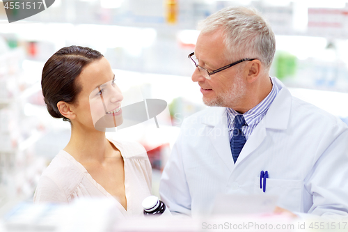 Image of apothecary and woman with drug at pharmacy