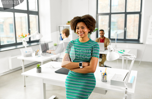 Image of happy smiling african american woman at office