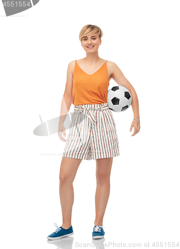 Image of smiling teenage girl with soccer ball