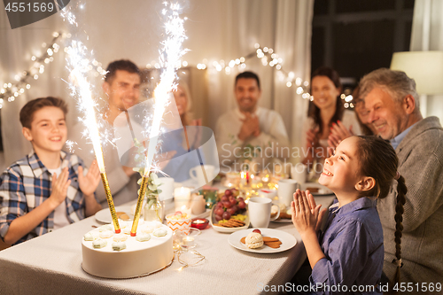 Image of happy family having dinner party at home