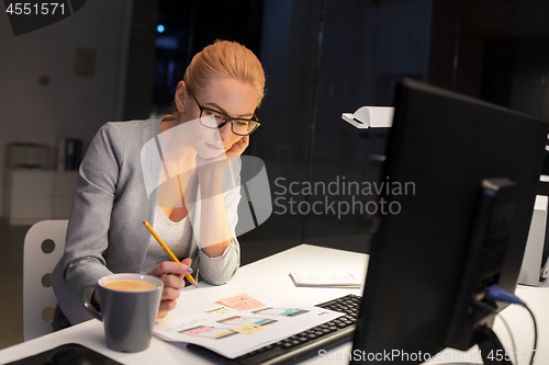Image of designer working on user interface at night office