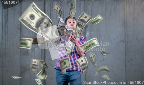 Image of businessman making the rain of money