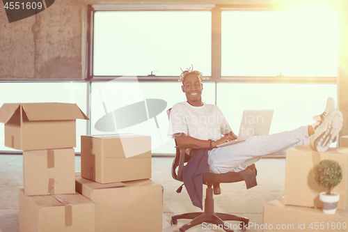 Image of young black casual businessman on construction site