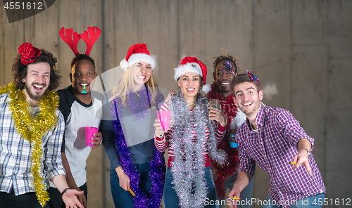 Image of multiethnic group of casual business people dancing with sparkle