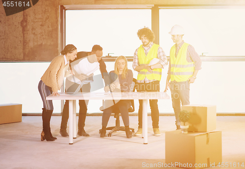 Image of group of multiethnic business people on construction site