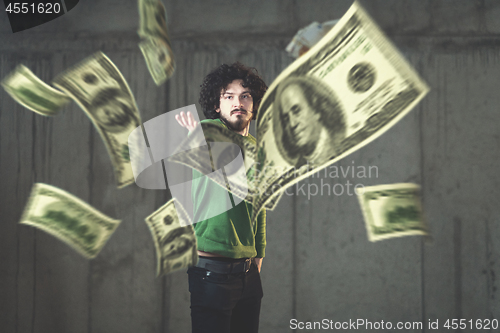 Image of businessman making the rain of money