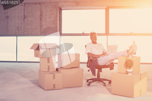 Image of young black casual businessman on construction site