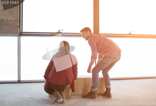 Image of business team carrying cardboard boxes