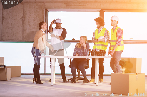 Image of group of multiethnic business people on construction site