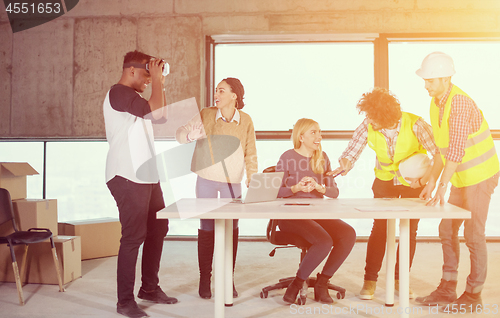 Image of group of multiethnic business people on construction site