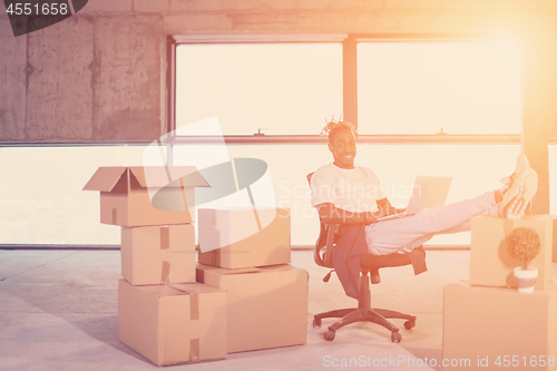 Image of young black casual businessman on construction site