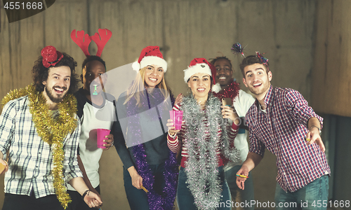 Image of multiethnic group of casual business people dancing with sparkle