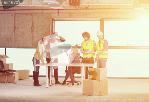 Image of group of multiethnic business people on construction site