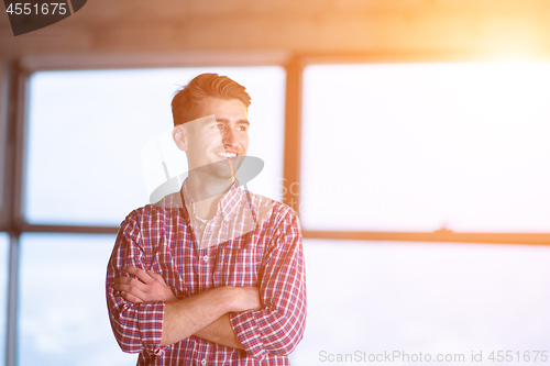 Image of portrait of young casual businessman on construction site