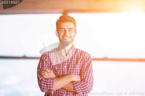 Image of portrait of young casual businessman on construction site