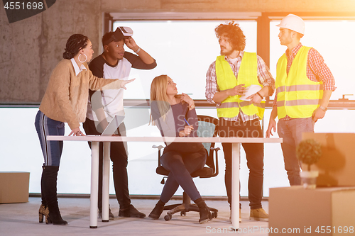 Image of group of multiethnic business people on construction site