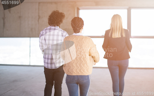 Image of business team carrying cardboard boxes