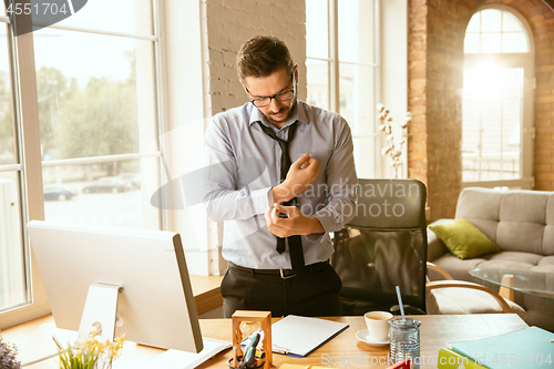 Image of Young businessman fired, looks upset