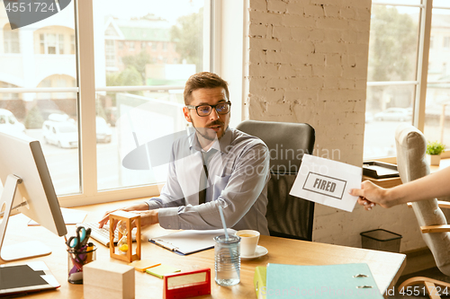 Image of Young businessman fired, looks upset