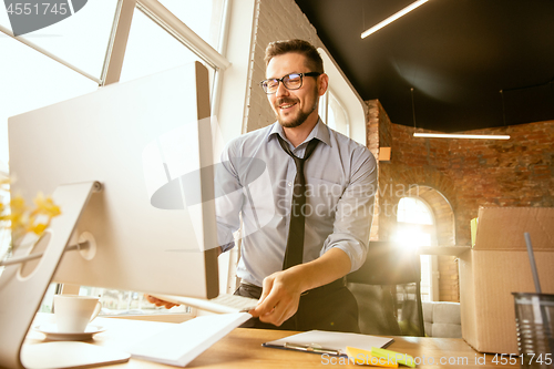 Image of Young businessman fired, looks upset