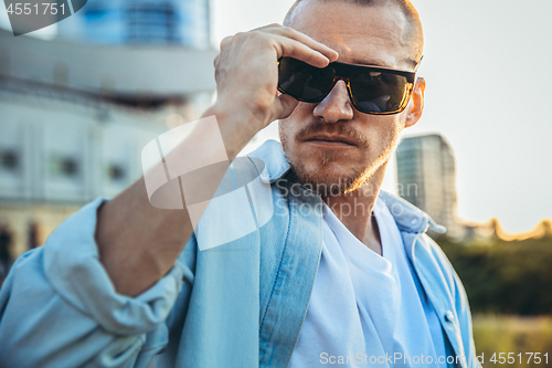 Image of Young caucasian man, modern shot in film grain effect