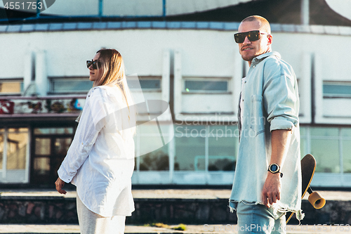 Image of Tanned young caucasian couple, modern lovestory in film grain effect