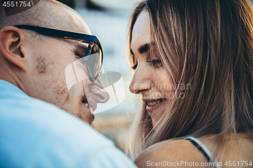 Image of Tanned young caucasian couple, modern lovestory in film grain effect