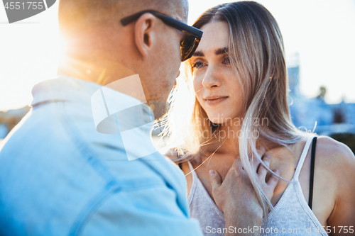 Image of Tanned young caucasian couple, modern lovestory in film grain effect