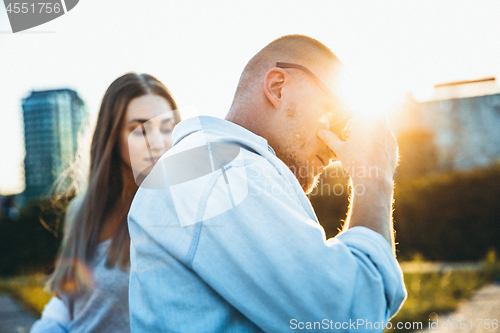 Image of Tanned young caucasian couple, modern lovestory in film grain effect