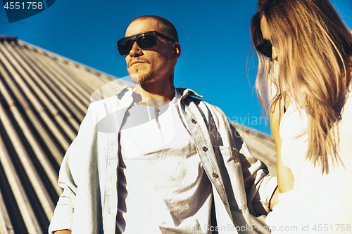 Image of Tanned young caucasian couple, modern lovestory in film grain effect