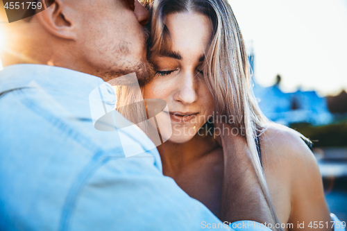 Image of Tanned young caucasian couple, modern lovestory in film grain effect