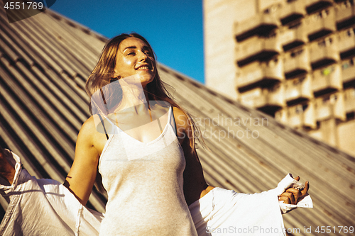 Image of Young caucasian woman, modern shot in film grain effect