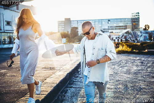 Image of Tanned young caucasian couple, modern lovestory in film grain effect