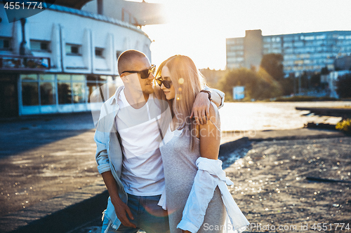 Image of Tanned young caucasian couple, modern lovestory in film grain effect