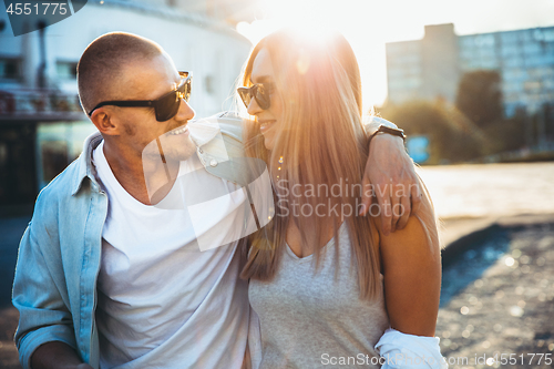 Image of Tanned young caucasian couple, modern lovestory in film grain effect