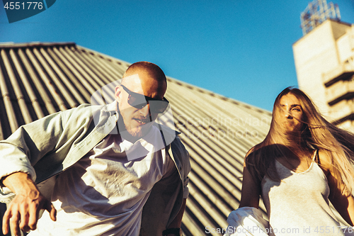 Image of Tanned young caucasian couple, modern lovestory in film grain effect