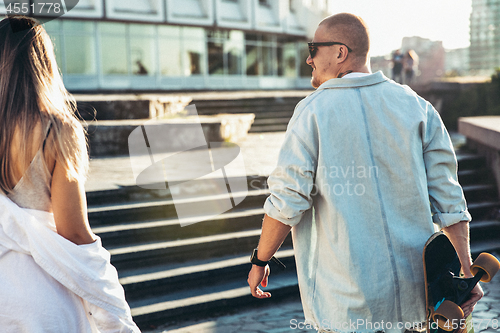 Image of Tanned young caucasian couple, modern lovestory in film grain effect