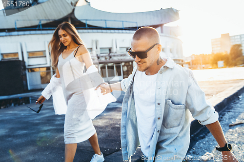 Image of Tanned young caucasian couple, modern lovestory in film grain effect