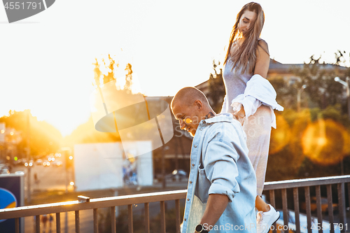 Image of Tanned young caucasian couple, modern lovestory in film grain effect