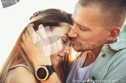 Image of Tanned young caucasian couple, modern lovestory in film grain effect
