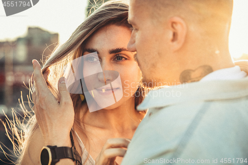 Image of Tanned young caucasian couple, modern lovestory in film grain effect