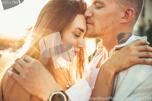 Image of Tanned young caucasian couple, modern lovestory in film grain effect