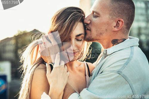 Image of Tanned young caucasian couple, modern lovestory in film grain effect