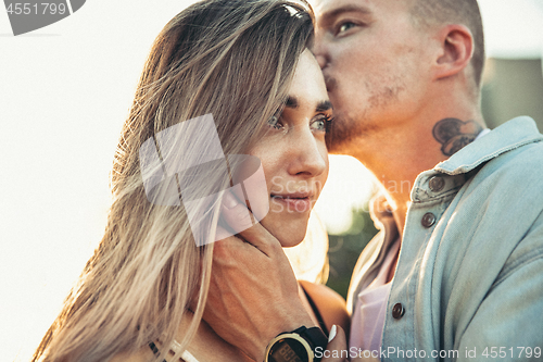 Image of Tanned young caucasian couple, modern lovestory in film grain effect