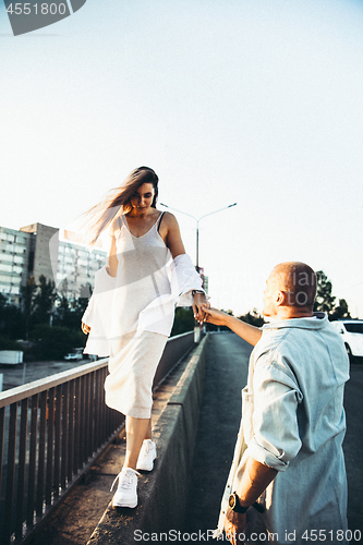 Image of Tanned young caucasian couple, modern lovestory in film grain effect