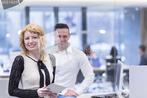 Image of Business People Working With Tablet in startup office