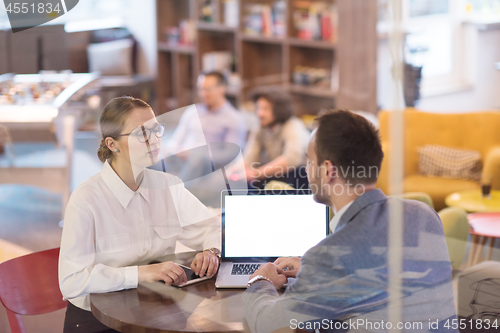 Image of Business team Working With laptop in creative office